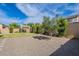Expansive backyard featuring a pergola, low-maintenance landscaping, and privacy fence at 809 W Coles Rd, Phoenix, AZ 85041
