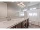 Double sink bathroom with spacious countertop, modern fixtures, and ample storage in sleek dark wood cabinets at 809 W Coles Rd, Phoenix, AZ 85041