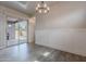 Dining area with modern lighting, slider door, and backyard views at 809 W Coles Rd, Phoenix, AZ 85041