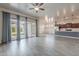 Bright and airy living room featuring a sliding glass door that opens to the backyard at 809 W Coles Rd, Phoenix, AZ 85041