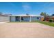 The spacious backyard features a covered patio and low maintenance gravel and artificial turf at 8326 N 8Th St, Phoenix, AZ 85020