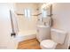 Bright bathroom with a shower-tub combination, modern vanity, and wood-look floors at 8326 N 8Th St, Phoenix, AZ 85020