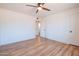 Bright bedroom features modern ceiling fan, new floors, and an open doorway to the bathroom at 8326 N 8Th St, Phoenix, AZ 85020