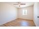 Bedroom with new flooring, a window letting in natural light, and neutral paint at 8326 N 8Th St, Phoenix, AZ 85020