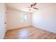 Bedroom with new flooring, a window letting in natural light, and modern ceiling fan at 8326 N 8Th St, Phoenix, AZ 85020