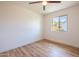 Bedroom with new flooring, a window letting in natural light, and neutral paint at 8326 N 8Th St, Phoenix, AZ 85020