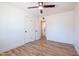Bedroom features modern ceiling fan, new floors, and access to the ensuite bathroom at 8326 N 8Th St, Phoenix, AZ 85020