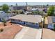 Aerial view of home with neutral tones, shutters, desert landscaping and driveway at 8326 N 8Th St, Phoenix, AZ 85020