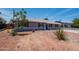 Charming single-story home featuring a blue front door, shuttered windows, and low-maintenance landscaping at 8326 N 8Th St, Phoenix, AZ 85020