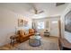 Inviting living room featuring a leather sofa, bright lighting, and hardwood floors at 8326 N 8Th St, Phoenix, AZ 85020