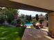 View of pool and landscaped yard from the covered patio, creating a relaxing outdoor space at 8851 S Juniper St, Tempe, AZ 85284