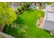 Lush backyard offers a swing set and space for outdoor activities in a well-maintained and inviting setting at 8851 S Juniper St, Tempe, AZ 85284