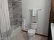 Bright bathroom featuring a shower and bathtub with marble tiling and neutral color scheme at 8851 S Juniper St, Tempe, AZ 85284