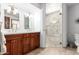 Refined bathroom with dual vanities and glass enclosed marble shower at 8851 S Juniper St, Tempe, AZ 85284