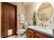 Charming half bath with stone-like walls and updated sink at 8851 S Juniper St, Tempe, AZ 85284