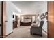 Bright bedroom features large bed,sitting area, and carpeted floors at 8851 S Juniper St, Tempe, AZ 85284