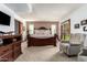 Spacious bedroom features carpet floors and double doors leading to backyard at 8851 S Juniper St, Tempe, AZ 85284