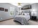 Comfortable bedroom featuring a queen bed, stylish decor, and a sunlit window with plantation shutters at 8851 S Juniper St, Tempe, AZ 85284
