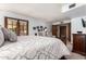Bright bedroom with double doors leading to backyard and classic furniture at 8851 S Juniper St, Tempe, AZ 85284