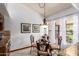 Bright breakfast nook with decorative lighting and backyard views at 8851 S Juniper St, Tempe, AZ 85284