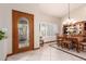 Welcoming entryway featuring decorative glass front door, tile flooring, and natural light from the windows at 8851 S Juniper St, Tempe, AZ 85284