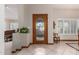Welcoming entryway featuring decorative glass front door, tile flooring, and natural light from the windows at 8851 S Juniper St, Tempe, AZ 85284