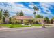 Charming single-story home with a well-manicured lawn, mature trees, and an attached two-car garage at 8851 S Juniper St, Tempe, AZ 85284