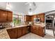 Updated kitchen with stainless steel appliances, granite countertops, and tile backsplash at 8851 S Juniper St, Tempe, AZ 85284