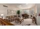 Bright living room with piano, neutral tones, plantation shutters, and comfortable seating at 8851 S Juniper St, Tempe, AZ 85284