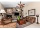 Inviting living room with stone fireplace, built-in shelving, and comfortable leather seating at 8851 S Juniper St, Tempe, AZ 85284