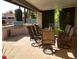 Covered patio with seating, BBQ grill, and lush landscaping, perfect for outdoor dining and entertaining at 8851 S Juniper St, Tempe, AZ 85284