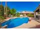 Sparkling pool with lush landscaping, offering a refreshing and inviting backyard oasis at 8851 S Juniper St, Tempe, AZ 85284
