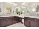 Bathroom features double sink vanity with dark cabinets, mosaic backsplash, and modern fixtures at 9508 W Jj Ranch Rd, Peoria, AZ 85383
