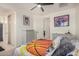 This bedroom offers a ceiling fan, closet, sports memorabilia, and natural light at 9508 W Jj Ranch Rd, Peoria, AZ 85383