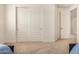 Bedroom with carpet, closet with sliding doors, and white walls at 9508 W Jj Ranch Rd, Peoria, AZ 85383