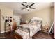 Bedroom with hardwood floors, natural lighting from the window, and ceiling fan at 1147 N Marvin St, Gilbert, AZ 85233