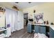 Bedroom featuring hardwood floors, a work station, and neutral paint at 1147 N Marvin St, Gilbert, AZ 85233