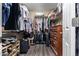 Walk-in closet with ample hanging space, built-in shelving, and a dresser for optimal organization at 1147 N Marvin St, Gilbert, AZ 85233
