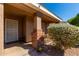 Inviting front porch area with decorative brick columns, lush landscaping, and a welcoming 'welcome' mat at 1147 N Marvin St, Gilbert, AZ 85233