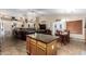 Large open floor plan with eat in kitchen with large island and stainless steel appliances at 1147 N Marvin St, Gilbert, AZ 85233
