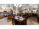Open concept kitchen, dining and living room with dark wood cabinets, stainless steel appliances and fireplace at 1147 N Marvin St, Gilbert, AZ 85233