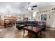 Bright open concept home with tile flooring, cozy seating and seamless transition to the kitchen at 1147 N Marvin St, Gilbert, AZ 85233