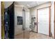 Pantry with stainless steel refrigerator and ample storage, providing convenient organization for kitchen essentials at 1147 N Marvin St, Gilbert, AZ 85233
