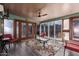Inviting enclosed patio with ample seating, ceiling fan, and stylish rug, perfect for relaxing or entertaining at 1147 N Marvin St, Gilbert, AZ 85233