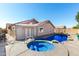 Inviting backyard with pool, spa, and desert-inspired landscaping, creating a serene outdoor retreat at 1147 N Marvin St, Gilbert, AZ 85233