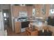 Charming kitchen with classic wood cabinets, white appliances, and ample countertop space at 1311 W Chesapeake Dr, Apache Junction, AZ 85119