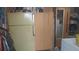Large refrigerator and storage options offer great utility in a storage area at 1311 W Chesapeake Dr, Apache Junction, AZ 85119