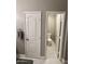 Neutral bathroom with a toilet closet and updated door frames and marble tile flooring at 135 S Abalone Dr, Gilbert, AZ 85233