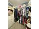 Well-organized walk-in closet offering ample storage with hanging rods and shelving, perfect for all your wardrobe needs at 135 S Abalone Dr, Gilbert, AZ 85233