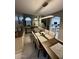 Bright dining room adjacent to living and kitchen with contemporary decor and finishes at 135 S Abalone Dr, Gilbert, AZ 85233